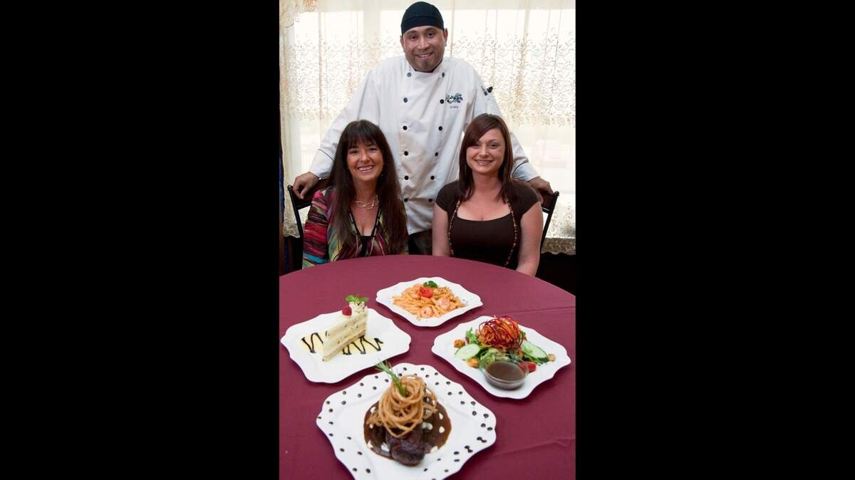 Flashback: Lory Wooley, left, her daughter Crystal Prud Homme DeLodder, right, and her son-in-law, chef Adrian Prud Homme DeLodder are pictured when Bella Vita Bistro first opened in 2010.