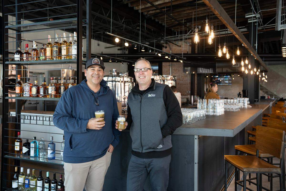 Wichita Brewing Company’s Director of Operations Joe Fernandez, left, and investor Jake Ramstack will open WBC Delano at 901 W. Douglas on Wednesday.