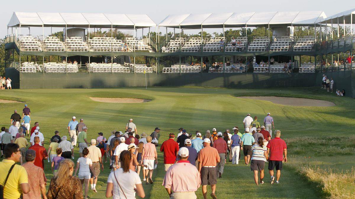 A large crowd walks to the 17th hole during the Scholfield Hyundai Shootout, a kickoff event for the Preferred Health Systems Wichita Open at Crestview Country Club. (June 18, 2012)