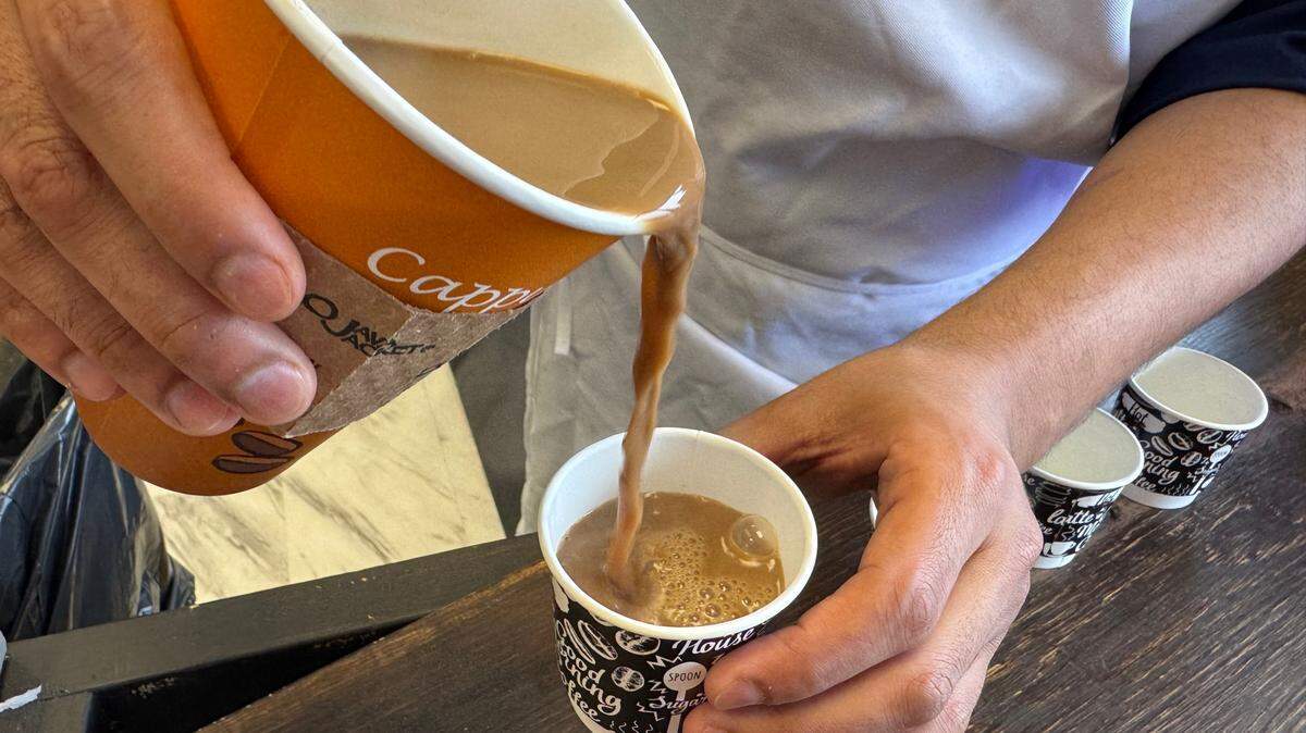 Naseem Allahabi pours samples of Turkish coffee at 360 Deli & Grill.