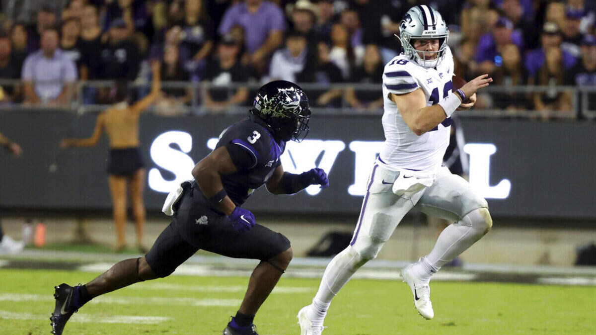TCU safety Mark Perry (3) pursues Kansas State quarterback Will Howard (18) during the first half of an NCAA college football game Saturday, Oct. 22, 2022, in Fort Worth, Texas. TCU’s defense won’t face a running quarterback this week, but that doesn’t lessen the challenge against West Virginia. (AP Photo/Richard W. Rodriguez)