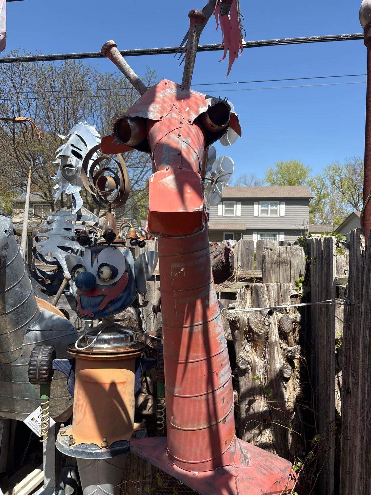 A red metal giraffe made by Steampunk artist Gary Pendergrass is among the items that will be included in an auction by McCurdy Real Estate & Auction.
