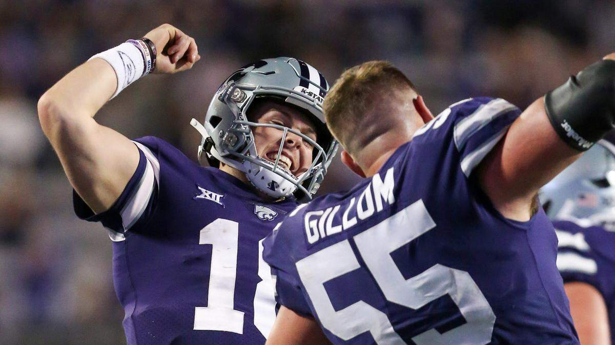 Kansas State Wildcats quarterback Will Howard (18) and offensive lineman Hayden Gillum (55) celebrate a touchdown during the fourth quarter against the TCU Horned Frogs at Bill Snyder Family Football Stadium.