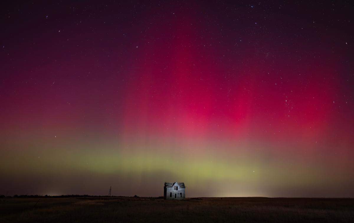 The northern lights can be seen above a dilapidated farmhouse near Marquette on Thursday night. The lights are caused by an interaction between the earth’s magnetic field and charged particles released by the sun.