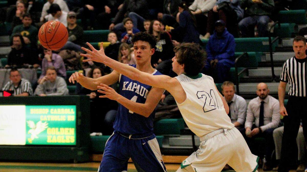 Kapaun’s Jarius Kennedy and Bishop Carroll’s Tanner Mans