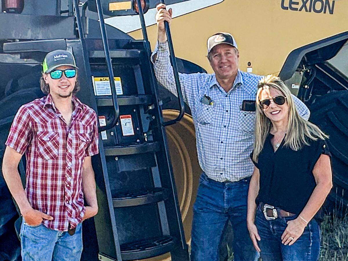 James Schlessiger, left, and his parents , Joe and Tricia. James was a patient of Dr. Dan Witt when he was younger, but now the Schlessigers and Dr. Witt are at odds over whether a solar project in Barton County should proceed.