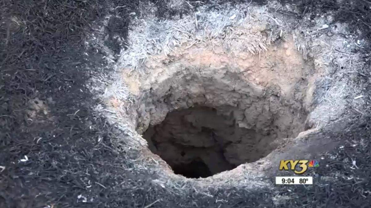 A hole in the ground of Midway, Arkansas, has fire and county officials stumped on what could have caused it.