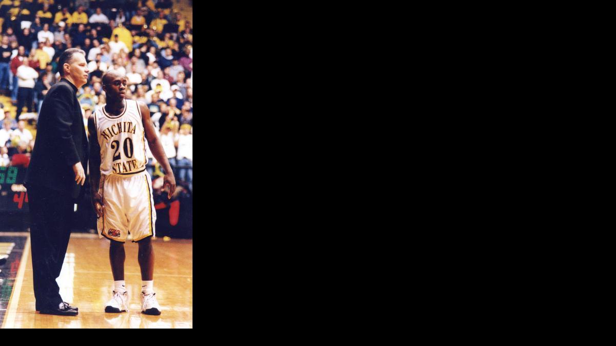 Coach Randy Smithson talks with guard Terry Hankton during a 1996-97 game. Smithson was hired to help bring back the "MTXE" mentality that had led to his father, Gene's success in the early 1980s. Smithson lasted four seasons before being fired in 2000.

