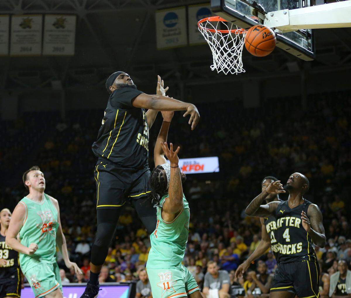 Shaq Morris of the Aftershocks blocks a shot against We Are D3 during the second half of their TBT game on Friday night at Koch Arena.