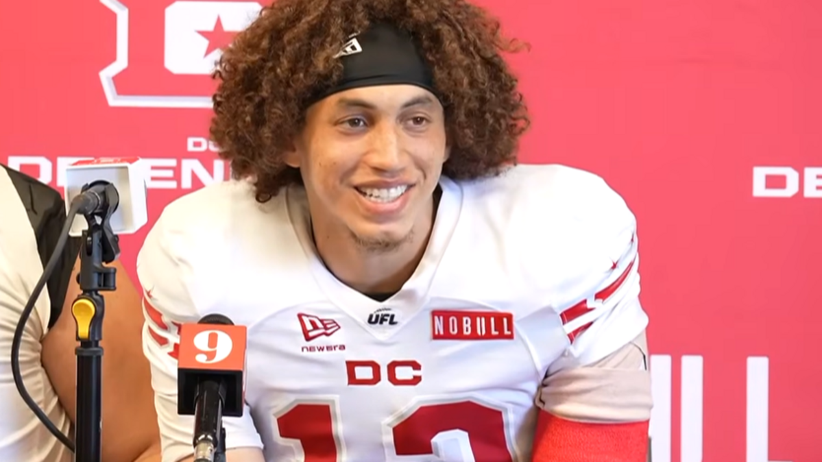 Former KU quarterback Jason Bean fields questions in a postgame press conference after returning to the field from a shoulder injury and leading the DC Defenders to a UFL playoff win Sunday. The team will play for the league championship on Saturday.