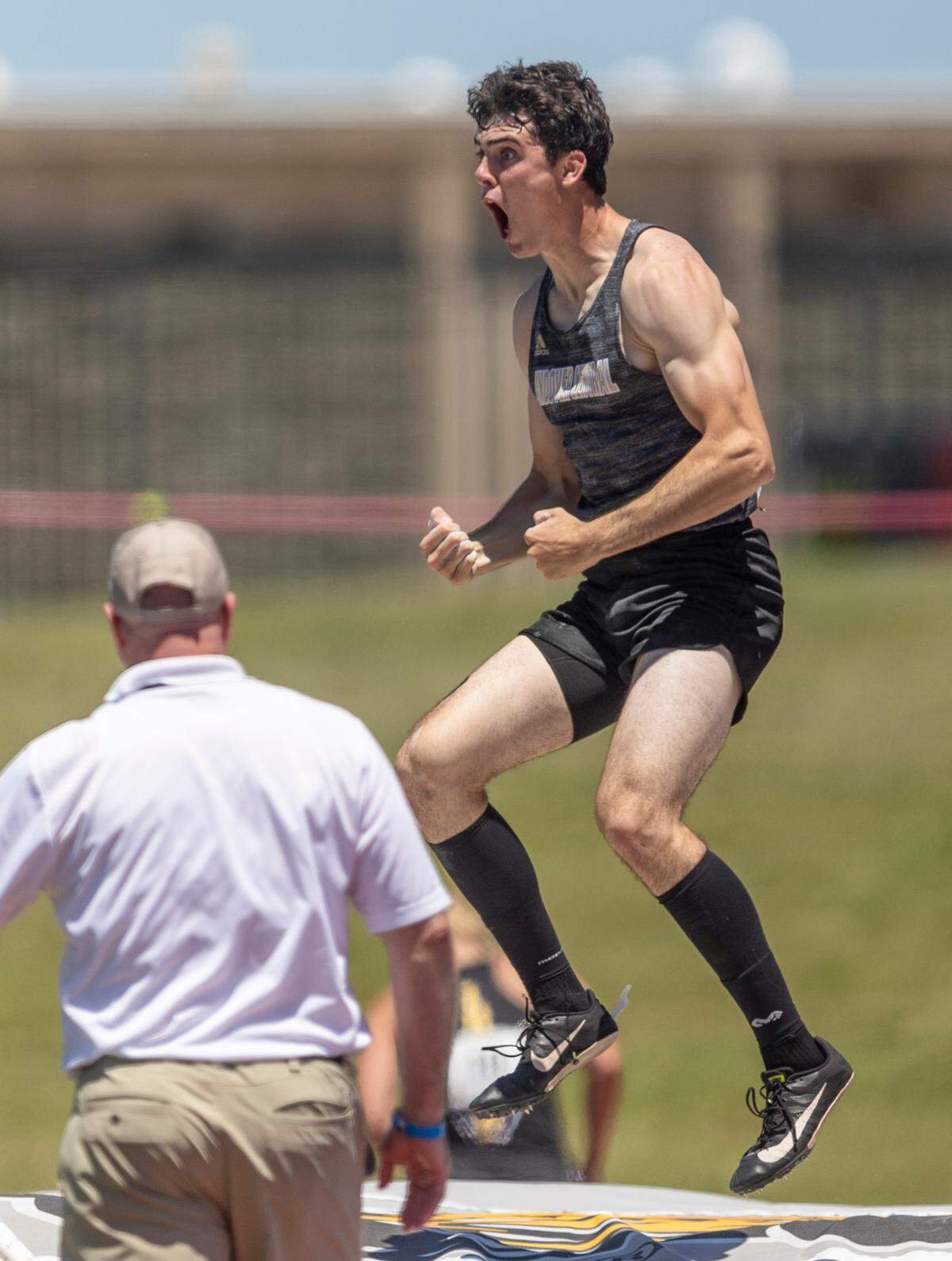 Andover Central’s Ashton Barkdull celebrates clearing 16 ft, 7 and 1/4 inch in the 5A pole vault to set a new meet record on Friday at the Kansas High School Track and Field Championships at Cessna Stadium.