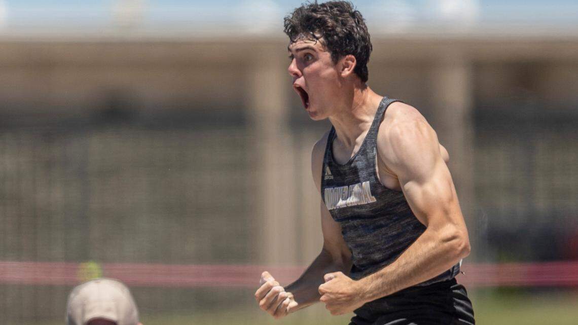 Andover Central’s Ashton Barkdull celebrates clearing 16 ft, 7 and 1/4 inch in the 5A pole vault to set a new meet record on Friday at the Kansas High School Track and Field Championships at Cessna Stadium.