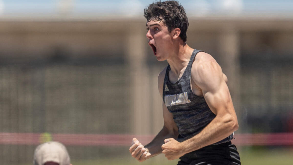 Andover Central’s Ashton Barkdull celebrates clearing 16 ft, 7 and 1/4 inch in the 5A pole vault to set a new meet record on Friday at the Kansas High School Track and Field Championships at Cessna Stadium.