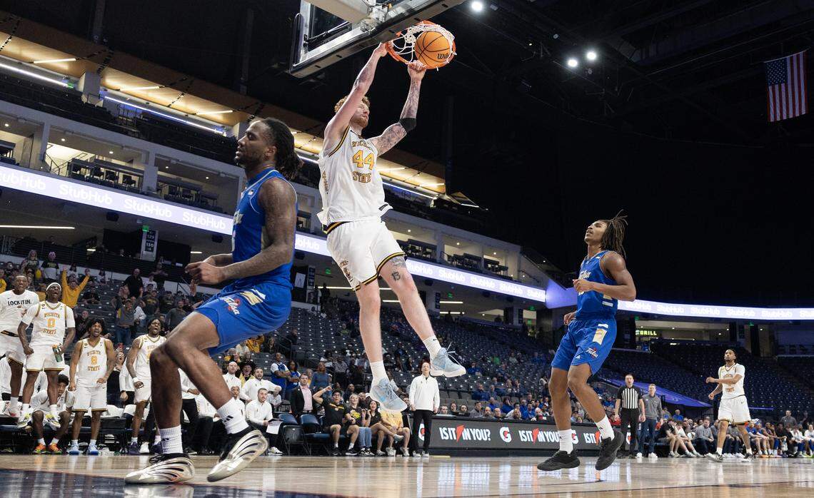 Wichita State’s Will Berg dunks the ball late in the second half of their AAC tournament semifinal game against Tulsa on Saturday in Birmingham.