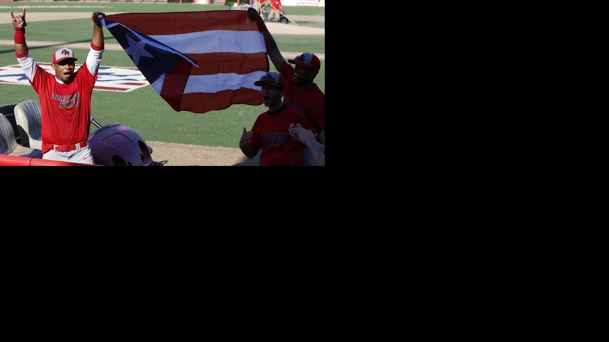The Puerto Rican National Team celebrates after defeating the Greeley (Colo.) Grays on Monday in the NBC World Series at Lawrence-Dumont Stadium. 

