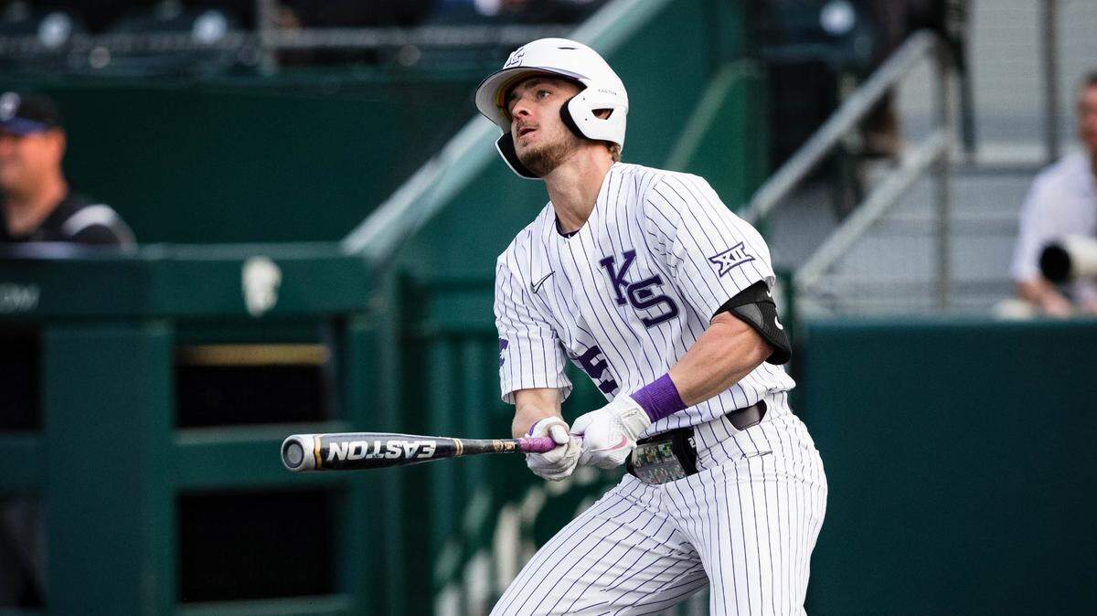 Kansas State short stop Nick Goodwin reacts after hitting a baseball for the Wildcats.