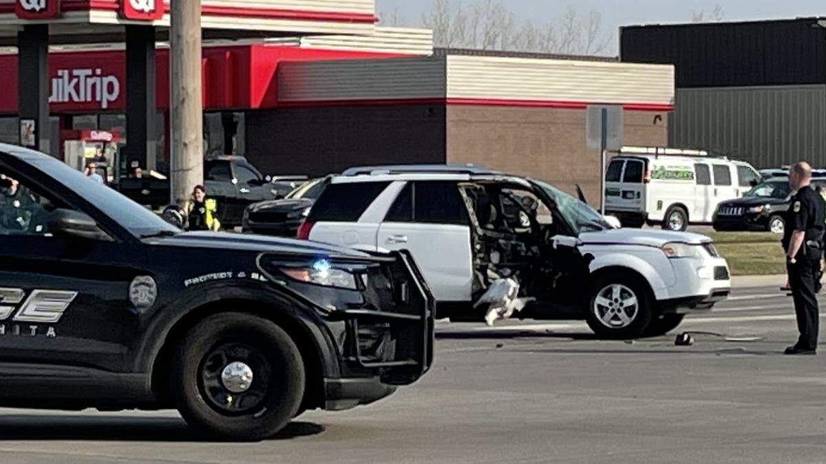 Pictured is a police vehicle and a white SUV that was involved in a fatal accident with a motorcycle at the intersection of Central and Greenwich on Monday afternoon. The motorcycle rider, a man in his 20s, died.