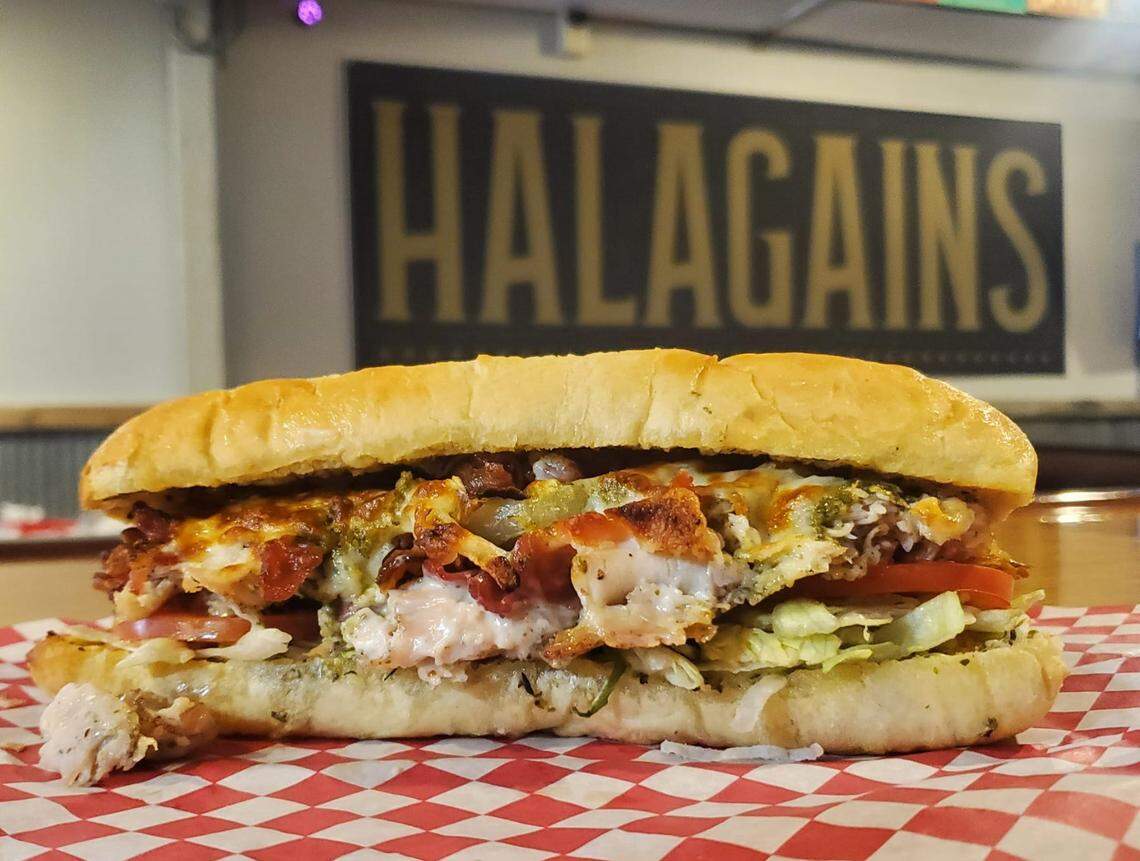 The Biggs Turkey sandwich at Halagains is made with thin-sliced smoked turkey and topped with Italian dressing and choice of Swiss or provolone cheese.