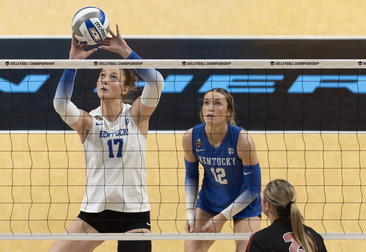 Kentucky outside hitter and Topeka native Brooklyn DeLeye sets the ball during the second set of their semifinal match against Wisconsin at the NCAA Volleyball Championship on Thursday night at the T-Mobile Center.