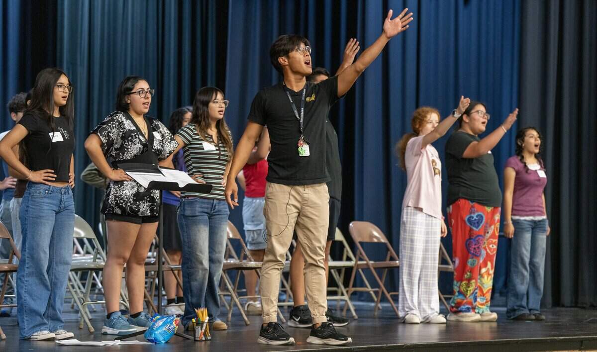 Panya Amphone encourages students to be proud and sing loudly during a four-day mariachi camp sponsored by USD 259. Amphone started the mariachi program at Mayberry Middle School three years ago.