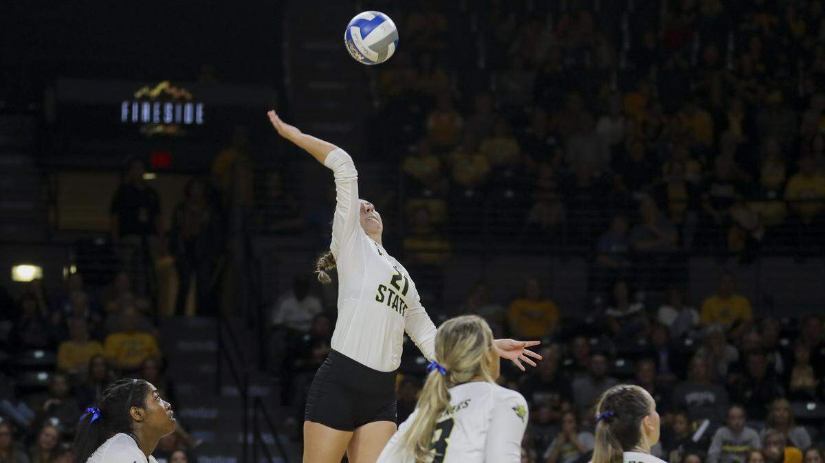 Wichita State outside hitter Megan Taflinger hits the ball against the Tulane Green Wave during the home-opener in Koch Arena. (Sept. 21, 2018)