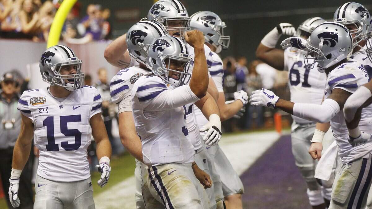 K-State quarterback Alex Delton (5) celebrates a touchdown in the Cactus Bowl.