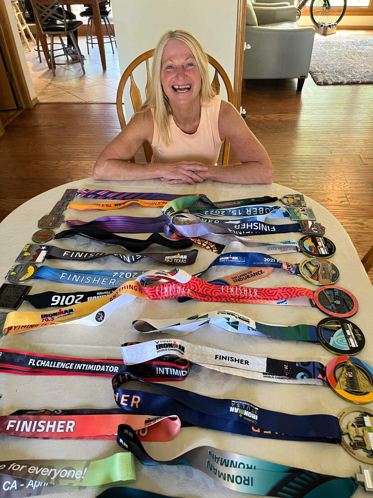 Wichitan Karlene Ivy with medals she has won in more than 100 races.
