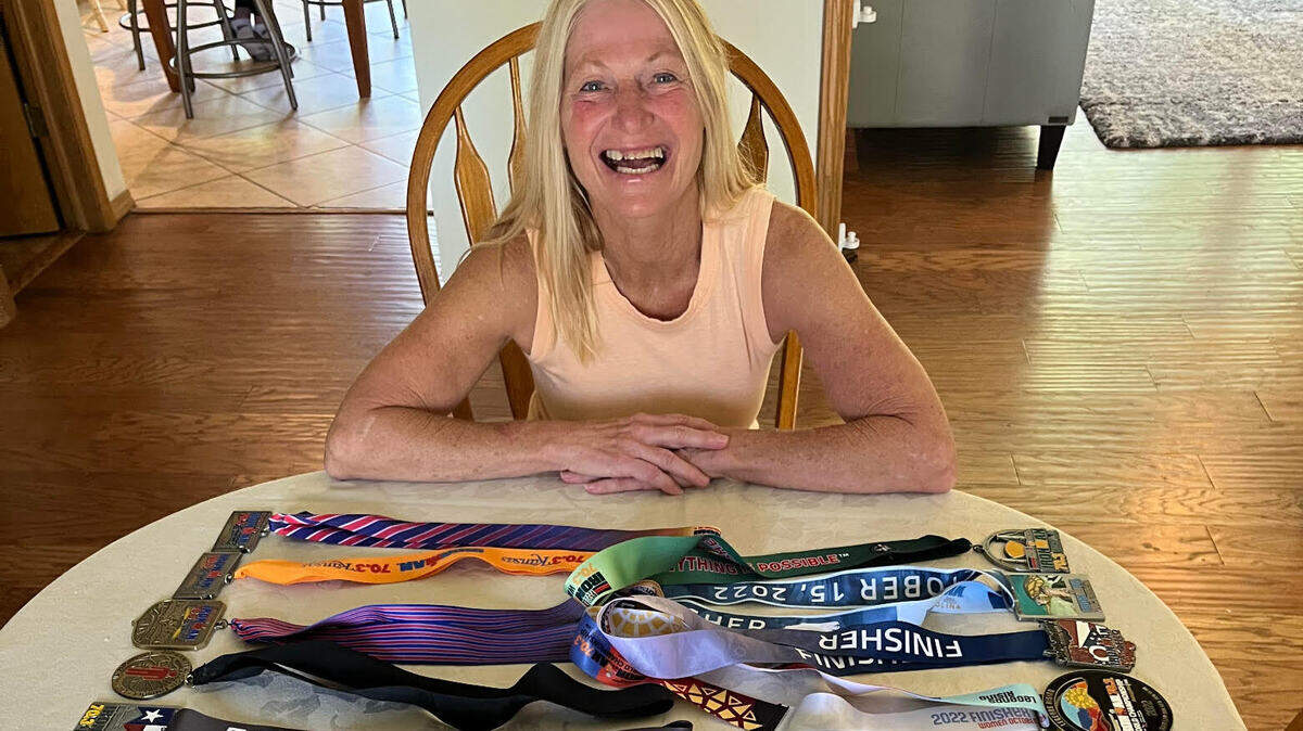 Wichitan Karlene Ivy with medals she has won in more than 100 races.