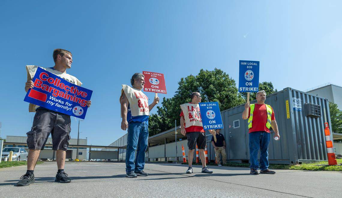 Striking aerospace workers, from left: Joe Ray, Tony Mower, Jesus Luna and Randy Gillette picket outside the Spirit AeroSystems factory on Saturday morning. Members of the machinist union voted down a proposed contract from Spirit earlier this week.