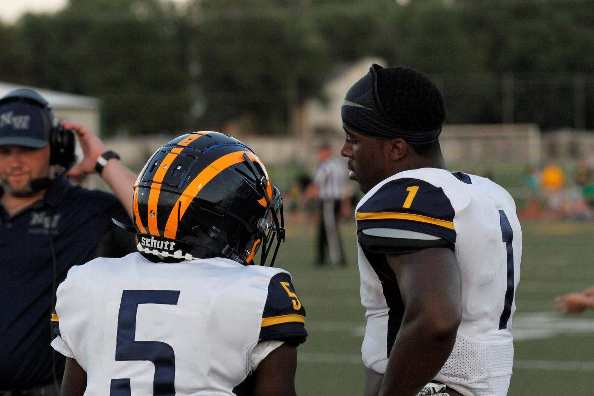 Wichita Northwest senior running backs Roy Johnson (5) and Breece Hall (1) get set before their game at Bishop Carroll on Friday night. The Grizzlies won 23-22. (Aug. 31, 2018)