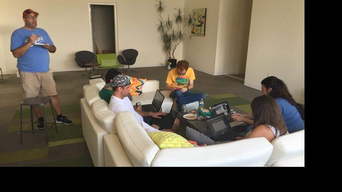 Draft day for Suzanne Tobias, lower right, who is playing fantasy football again this year.