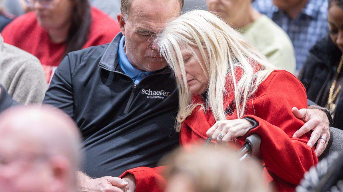 Scott Stiles and his wife Shannon take part in a prayer vigil in Wichita for those affected by the crash of American Airlines flight 5342 in Washington, D.C. the day before.