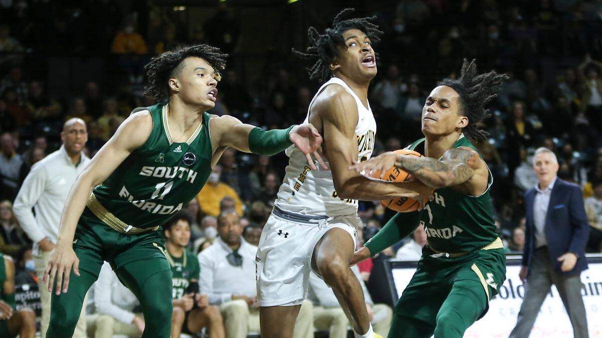 Wichita State’s Chaunce Jenkins is fouled while driving to the basket during the first half against South Florida on Saturday at Koch Arena.