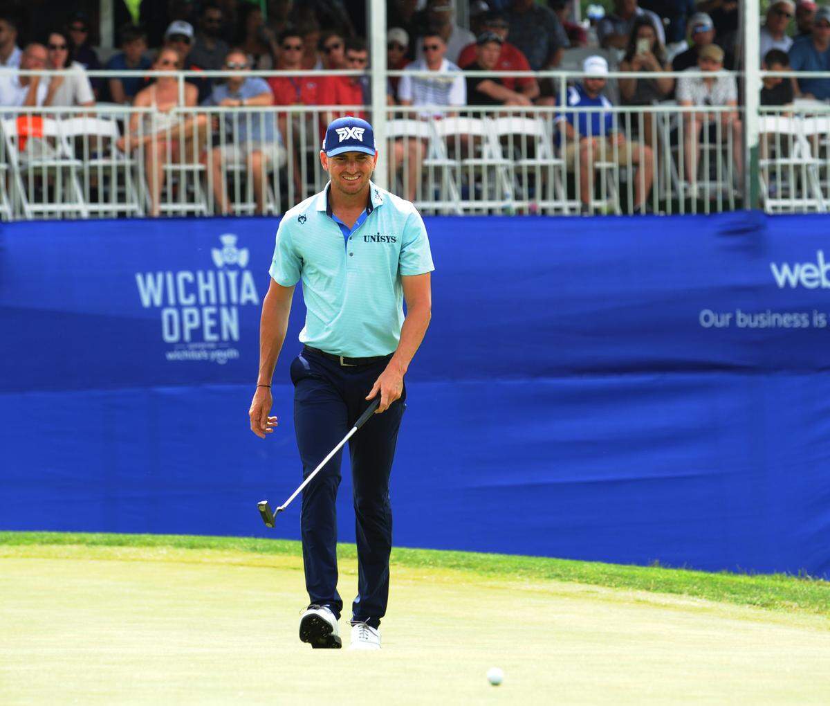Kevin Dougherty entertained the Wichita crowd at the No. 17 hole at Crestview Country Club, racing his caddie down the fairway to the green. Dougherty is in a four-way tie for second place entering Sunday at 11-under.