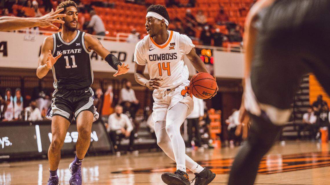 Oklahoma State guard Bryce Williams drives against Kansas State forward Antonio Gordon.