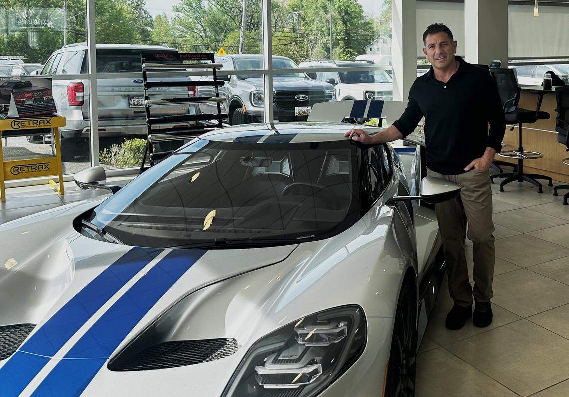 In a half-billion-dollar “luck of a deal,” Brandon Steven has acquired a portfolio of a dozen dealerships from Kody Holdings in Maryland. He’s shown next to a 2019 Ford GT at one of his new dealerships on Thursday.