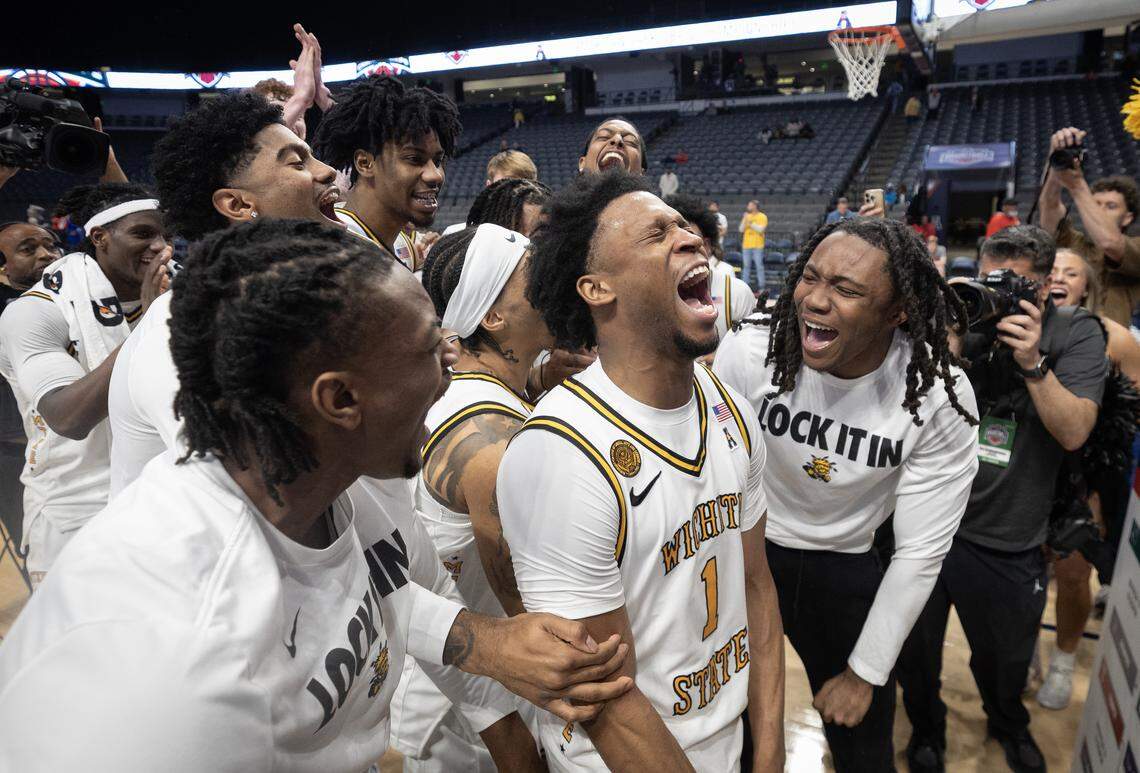 Wichita State’s Kenyon Giles celebrates with teammates after he scored 27 points in the Shockers’ 81-68 win over Tulsa in the AAC tournament semifinal game on Saturday in Birmingham.
