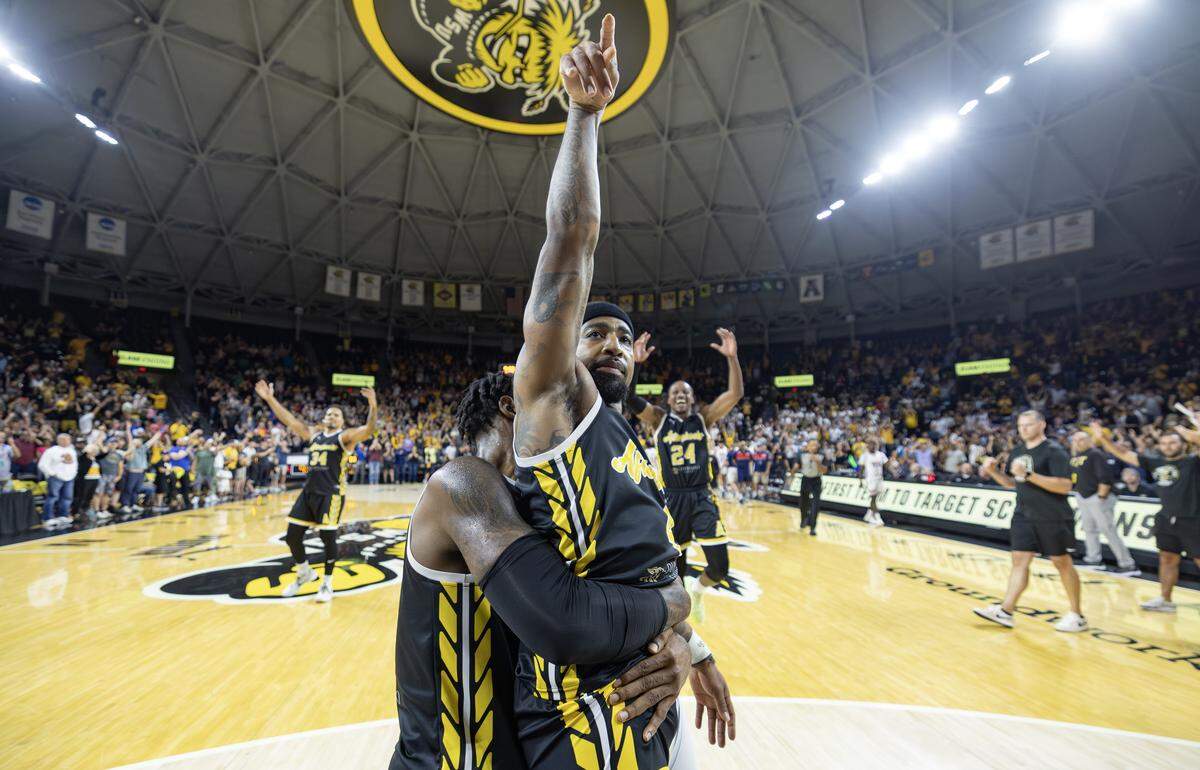 Marcus Keene is lifted by teammate Rashard Kelly after Keene’s technical foul free throw ended the game against We Are D3 and sent the AfterShocks to the final of the TBT tournament to play for a million dollars.