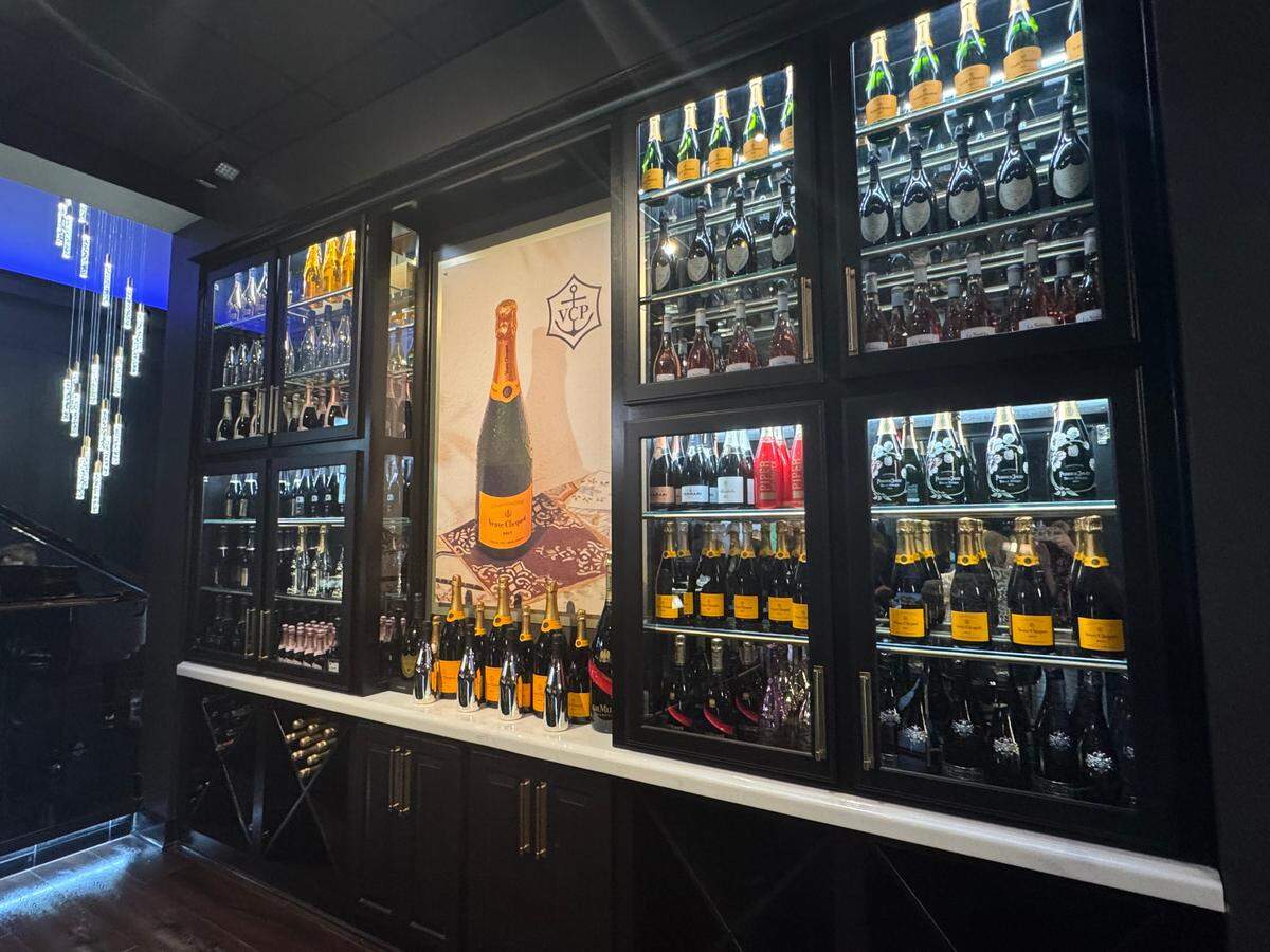 Owner Greg Hiser created a “wall of champagne” in KVH’s bar.