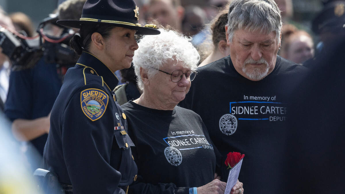 The family of Sedgwick County Deputy Sidnee Carter attend a ceremony in front of City Hall on Wednesday that honored the area’s fallen law enforcement officers. Carter was killed in 2022 when her patrol car was hit by another car while she was responding to a call.