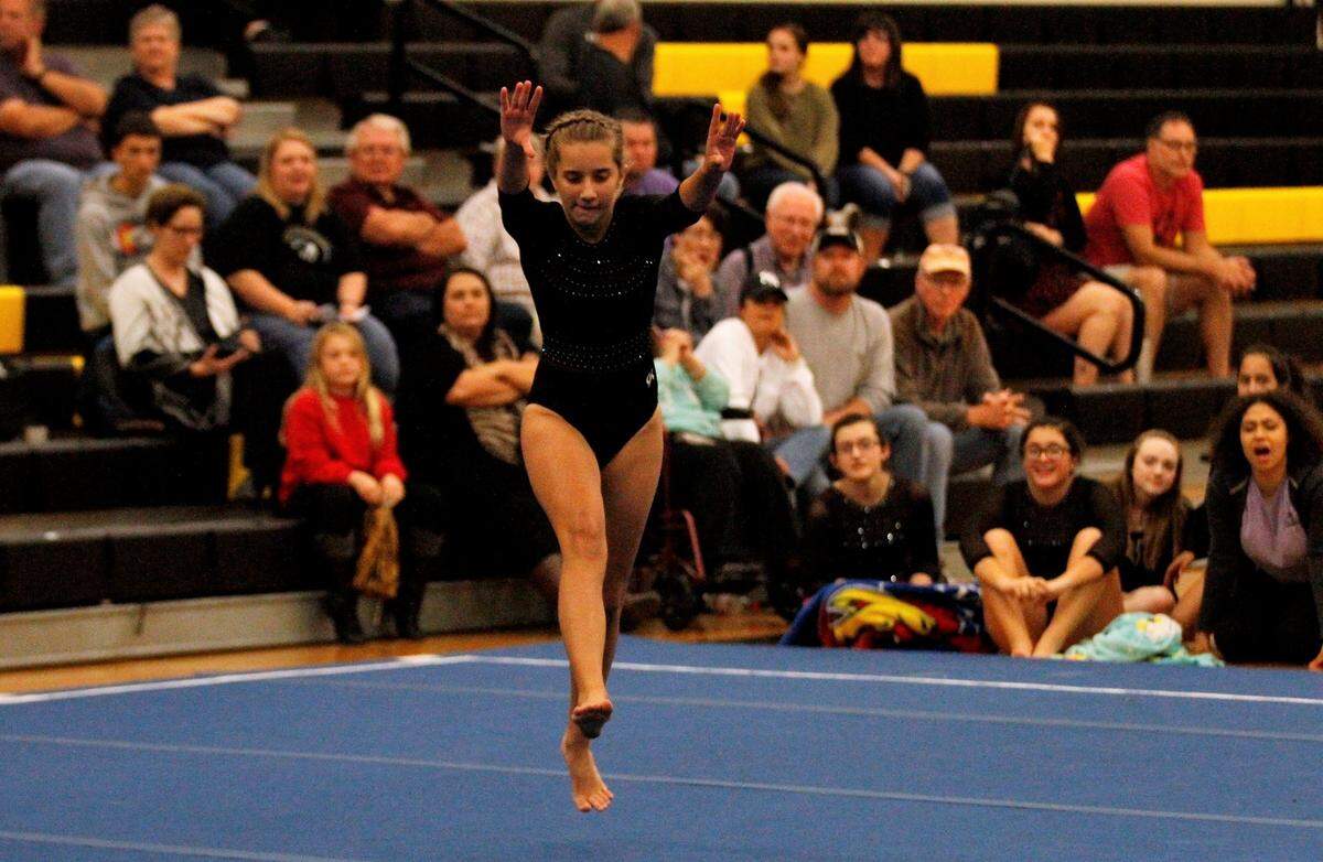 Newton’s Acacia Penner prepares for a back handspring during the Railers’ home meet against Emporia on Monday night. (Oct. 8, 2018)