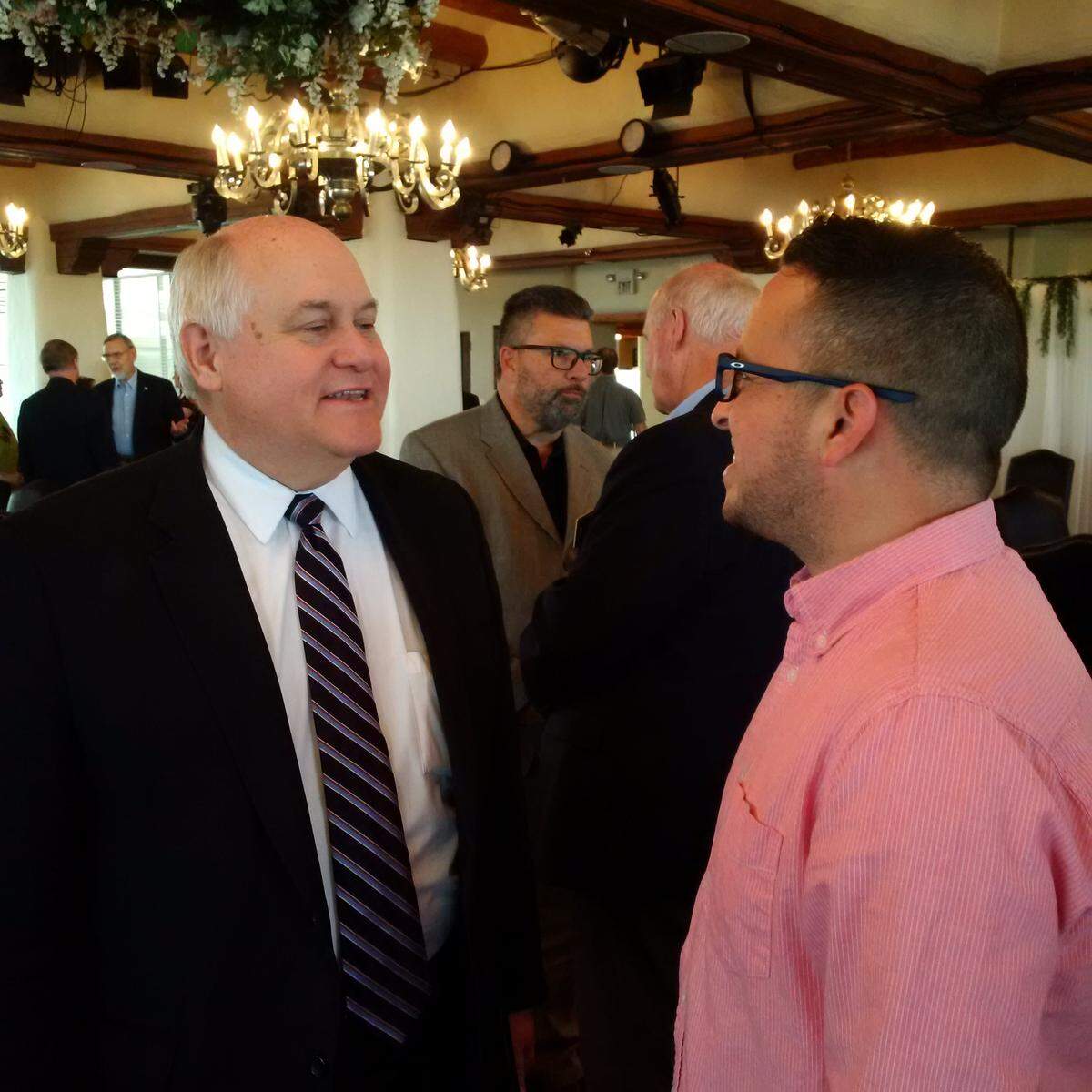 Rep. Ron Estes chats with Park City council member Ben Sauceda after speaking to the Republican Wichita Pachyderm Club.