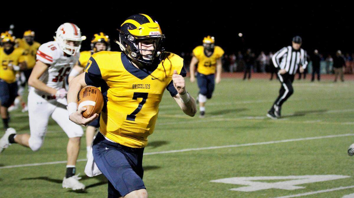 Reagan Jones sprints downfield as part of his big night in the Grizzlies’ state semifinal game against Maize on Friday. (Nov. 16, 2018)