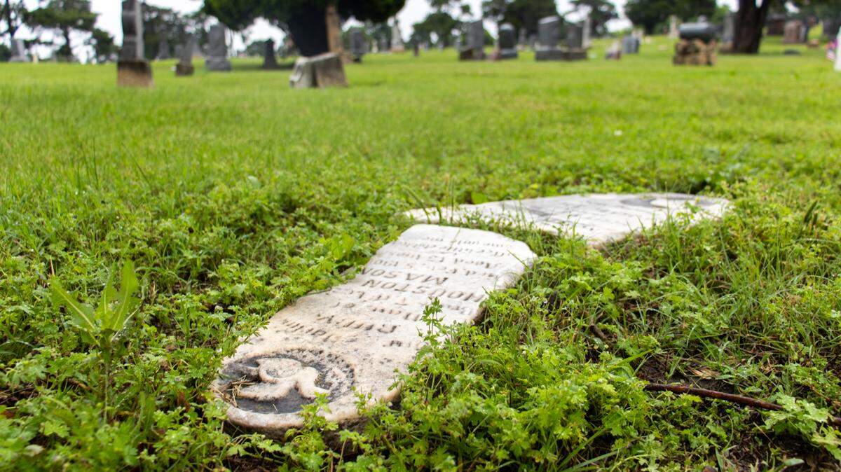 The gravestones of Dale and Ruby Tanton, two children who died in the early 1900s, lie broken at Highland Cemetery, Wichita’s oldest cemetery. The historic cemetery is owned by the city of Wichita, which is responsible for the management of cemeteries. However, individuals are responsible for the care and upkeep of headstones and grave markers.