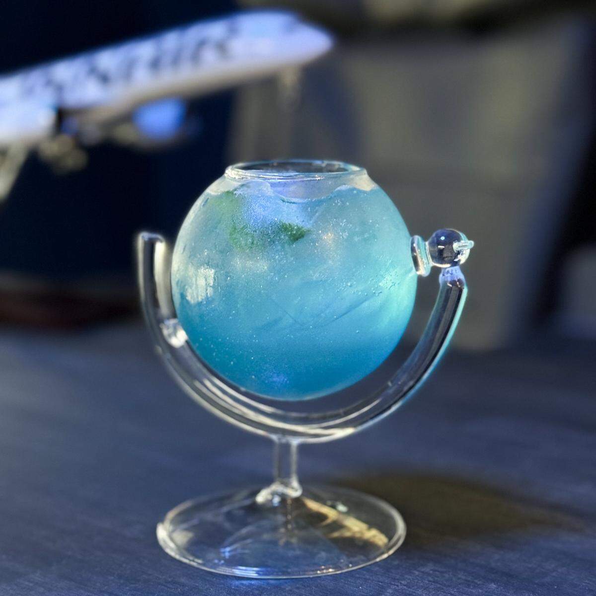 Many of the cocktails at Flight 1868 come in glasses with fun shapes, like this globe. There’s also a milk carton, a diamond and a bird cage.