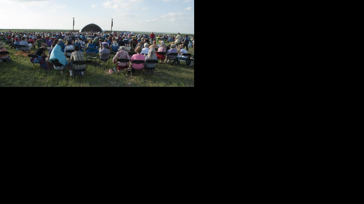After an afternoon of education talks, nature walks, wagon rides and wind, a crowd of more than 7,000 settle in to listen to the Kansas City Symphony at the ninth annual Symphony in the Flint Hills concert at Rosalia Ranch, just north of Rosalia.