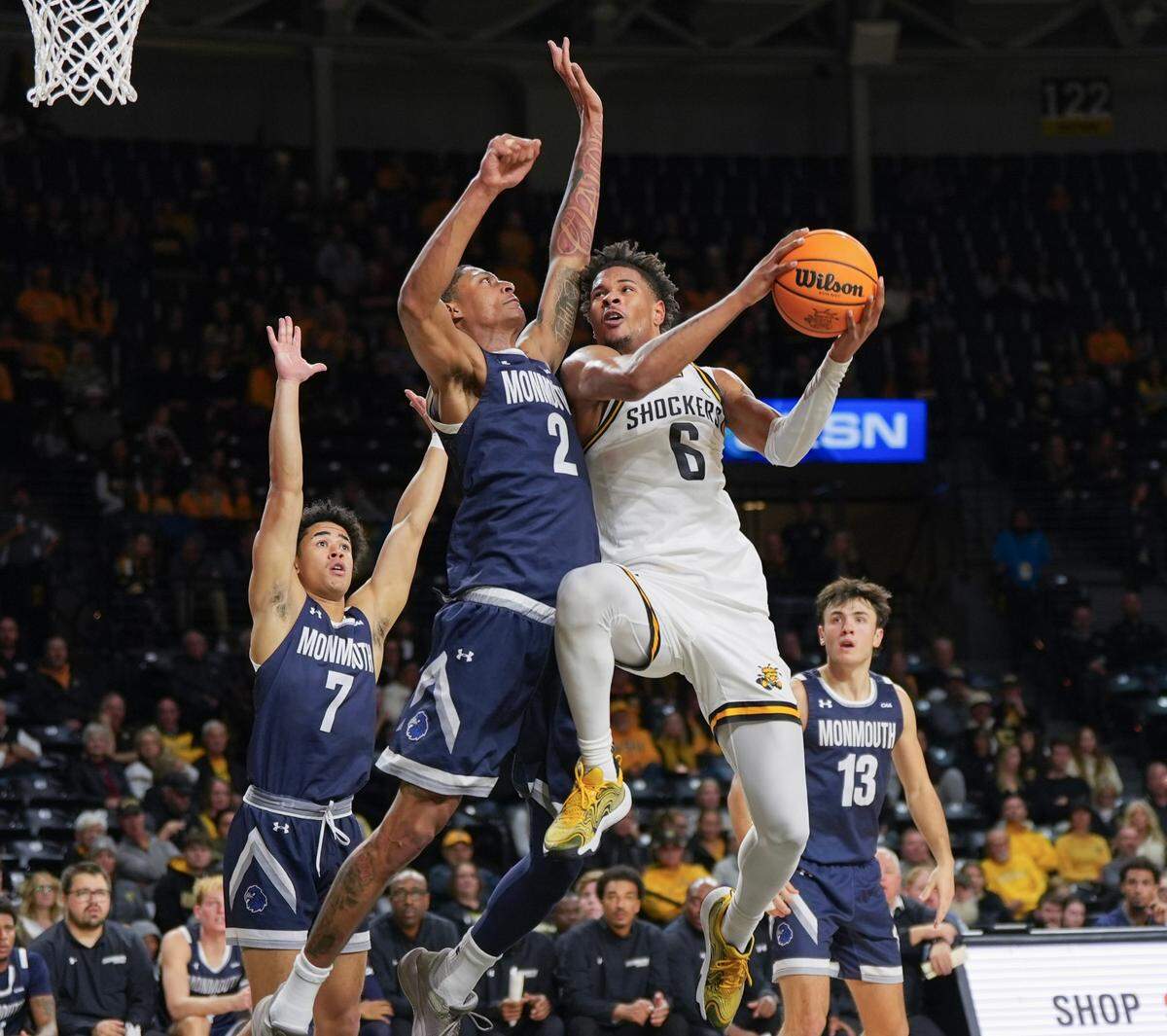 Wichita State University’s Corey Washington drives to the lane in the first half against Monmouth at Koch Arena. 
