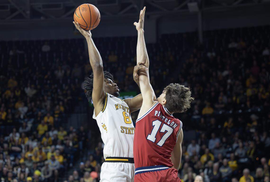 Wichita State’s Dillon Battie shoots over Florida Atlantic’s Xander Pintelon during the first half on Saturday at Koch Arena.