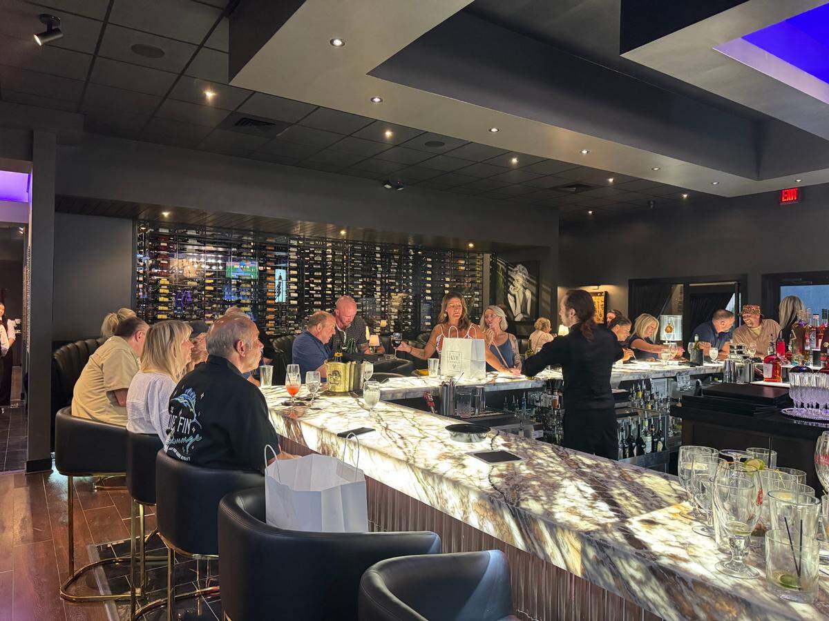 KVH’s U-shaped bar is surfaced with back-lit onyx, which creates a glowing effect.