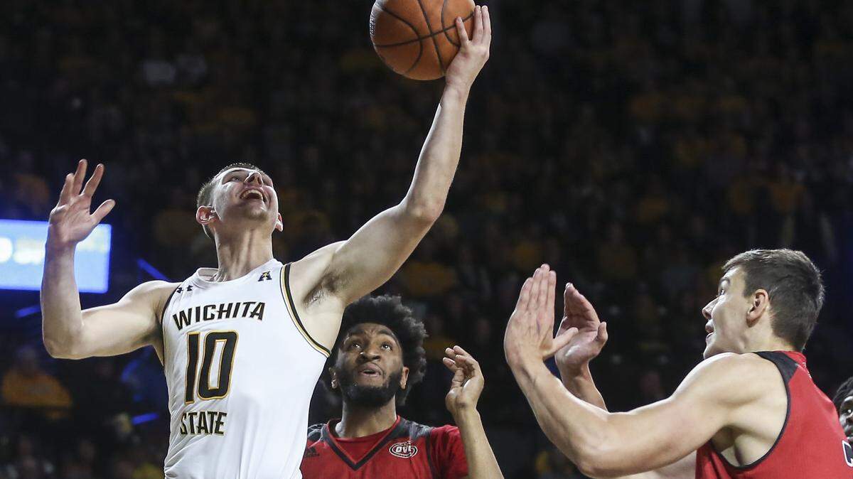 Wichita State guard Erik Stevenson shoots against Jacksonville State forward Christian Cunningham during the first half of their game at Koch Arena on Wednesday.